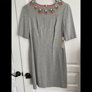 Fitted grey dress with neckline emblishment